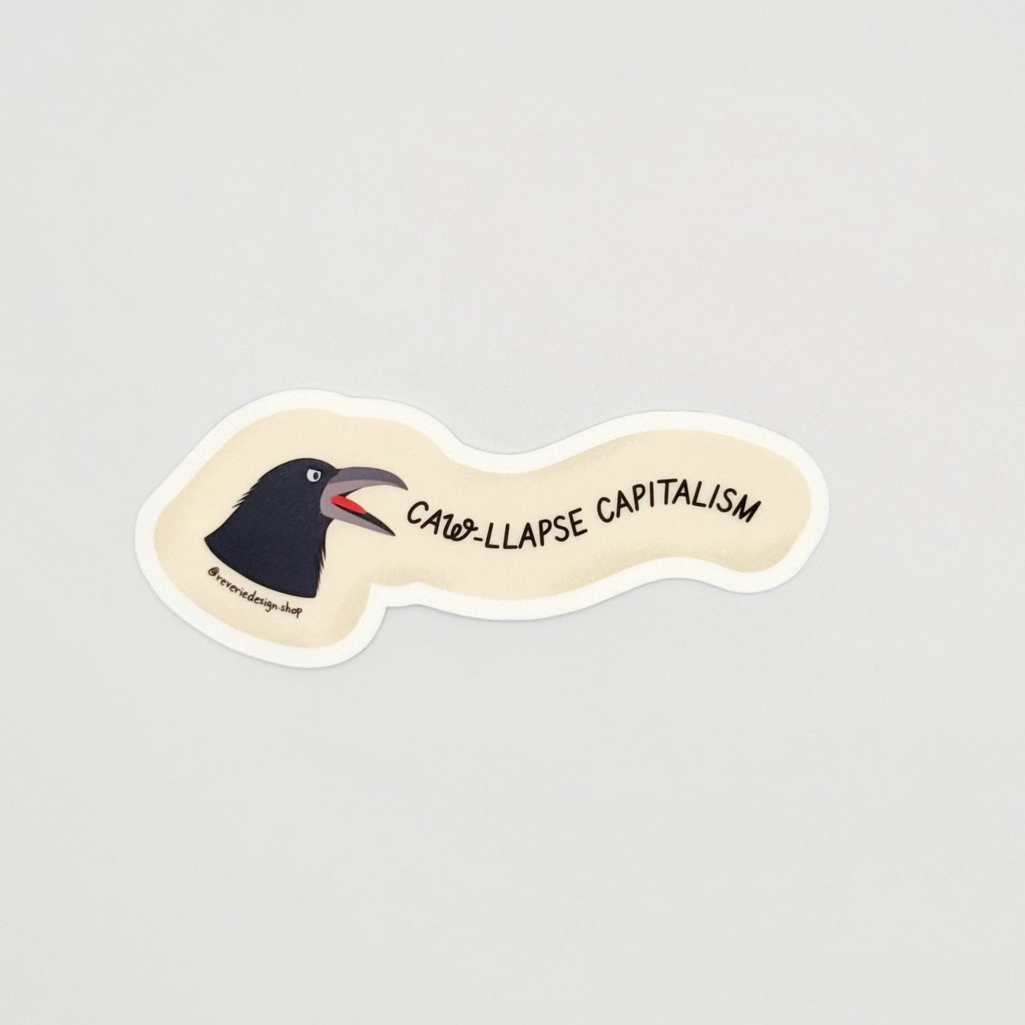 Angry crow sticker with text ‘Caw-llapse Capitalism’ in bold