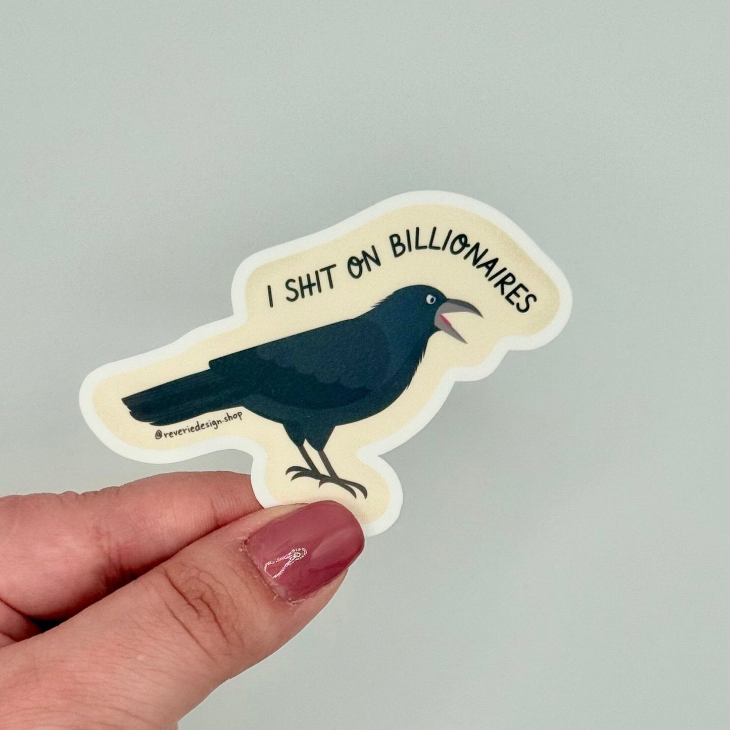 Funny anti-capitalist vinyl sticker featuring black crow and protest message ‘I shit on billionaires’