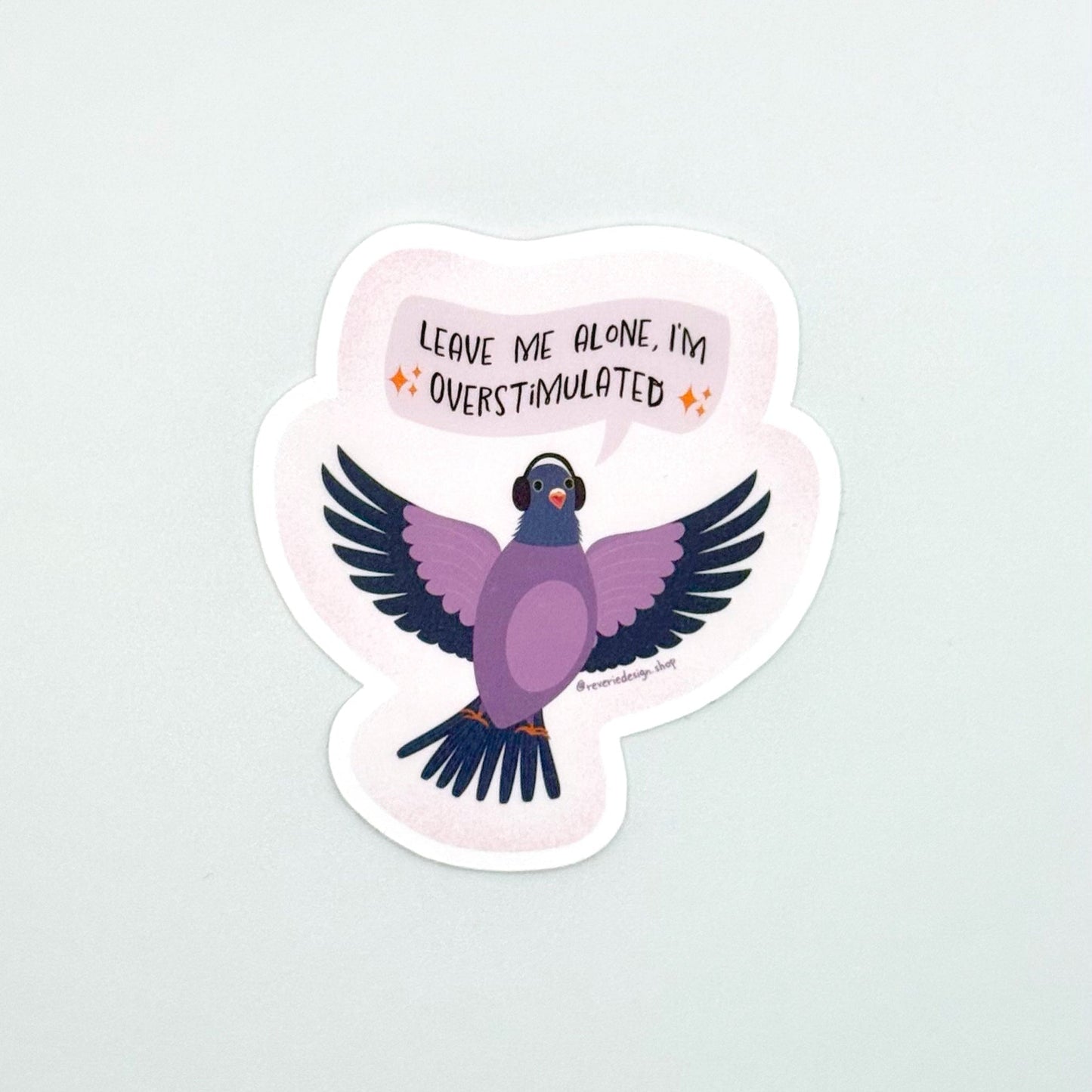 Neurodivergent pigeon sticker for sensory overstimulation with funny text ‘Leave me alone I’m overstimulated’