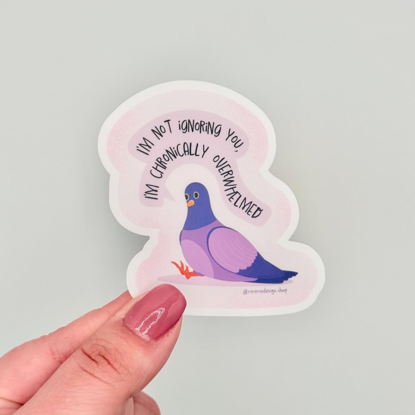 Vinyl sticker with tired pigeon and text ‘I’m not ignoring you I’m chronically overwhelmed’