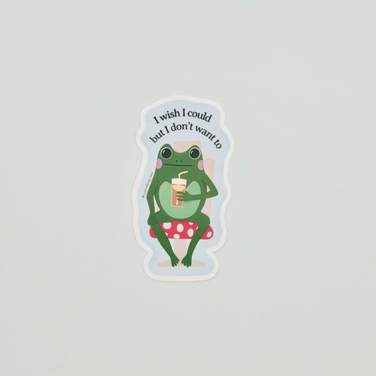 Avoidance humor sticker with cute frog on mushroom chair and text ‘I wish I could, but I don’t want to’