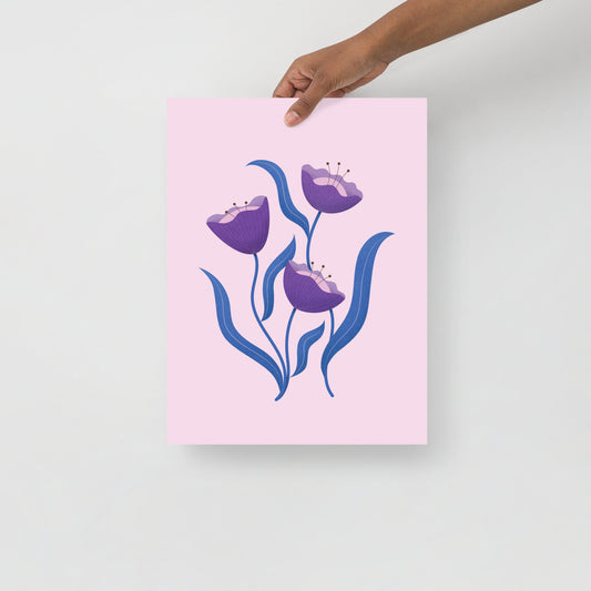 Whimsical pastel floral print with purple flowers and blue leaves on pink background
