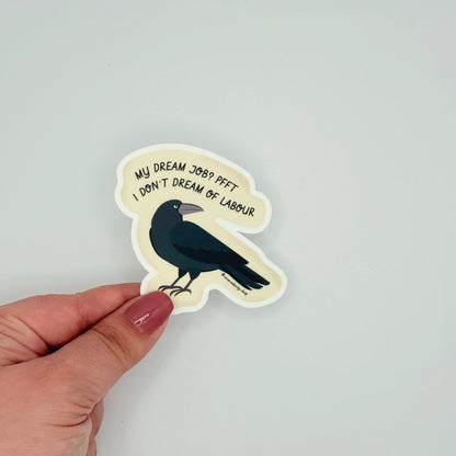 Matte sticker featuring smug angry crow and anti-work sentiment with text ‘My dream job? Pfft. I don’t dream of labor’