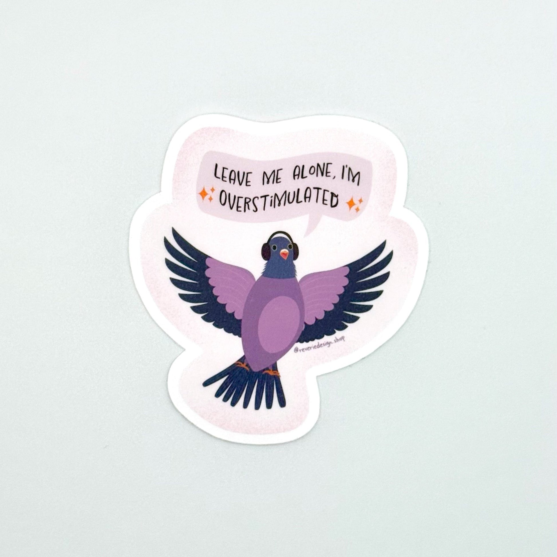Neurodivergent pigeon sticker for sensory overstimulation with funny text ‘Leave me alone I’m overstimulated’
