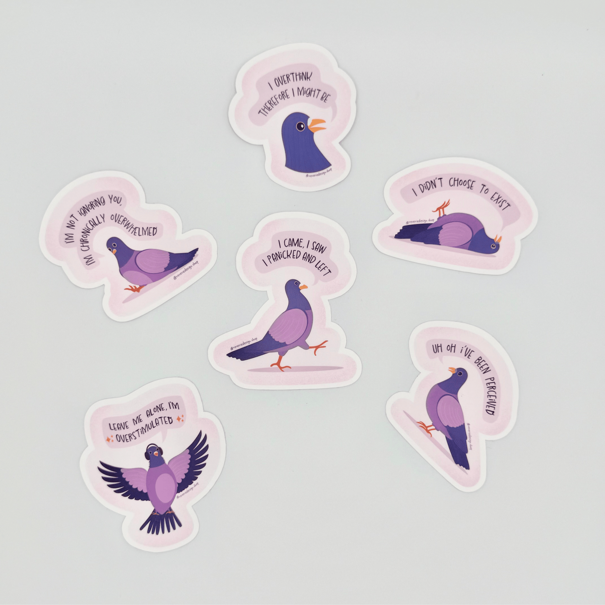 Top shot of full set of Pigeon Panic Party stickers scattered. Funny neurodivergent pigeons