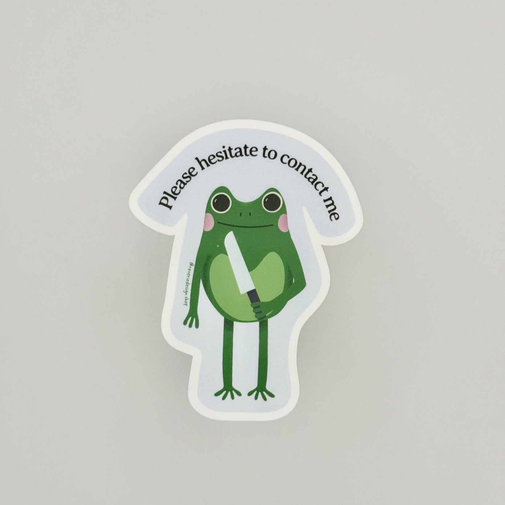 Anti-social office humor sticker with sarcastic frog illustration and text "Please Hesitate to Contact Me"